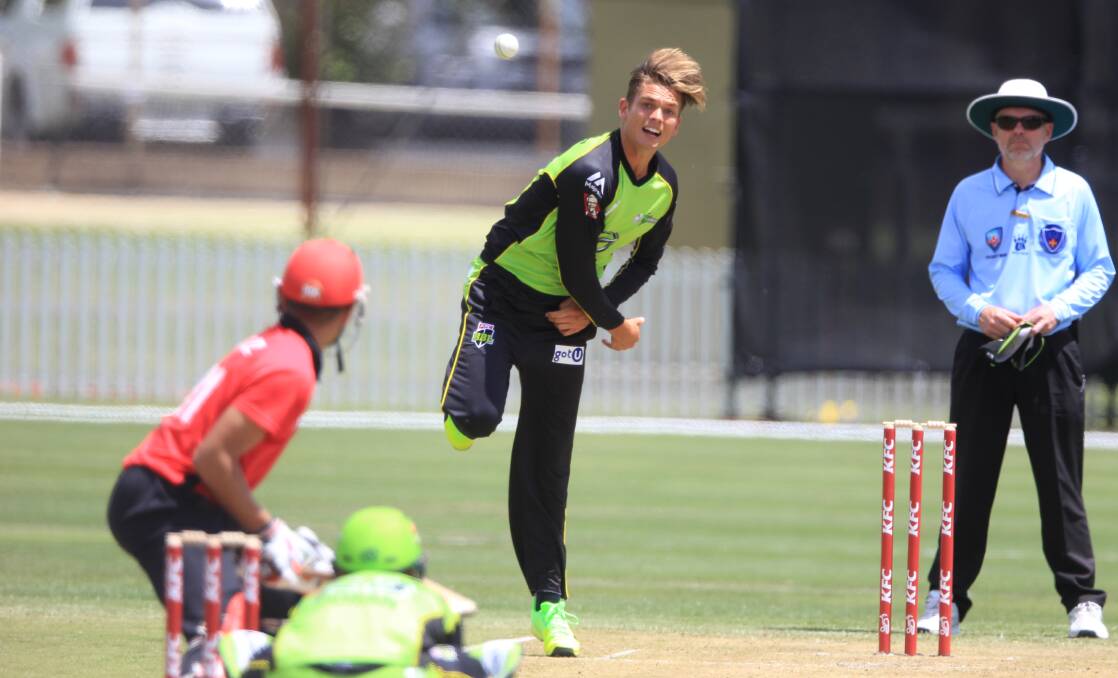 BOWLER'S PITCH: Sydney Thunder star Chris Green releases the ball at Wade Park during his side's BBL trial against Hong Kong in December 2016. Photo: PHIL BLATCH