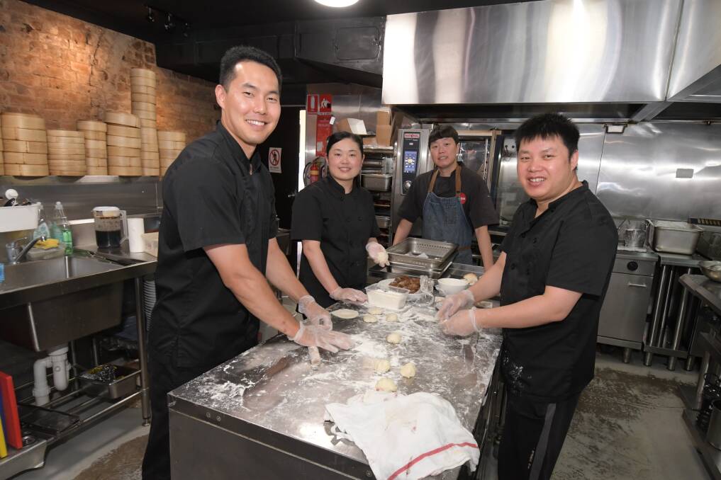 TASTY MORSELS: Chun Sung Park, Fang Xu, Harvey Sung and Jun dui Hu in the Mr Lim kitchen. Photo: JUDE KEOGH.