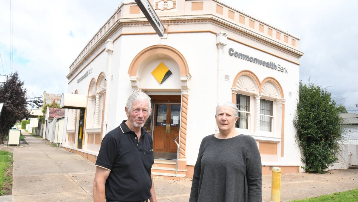BAD DECISION: Hugh Oldham and Jen Willox are not impressed with the Commonwealth Bank. Photo: JUDE KEOGH.
