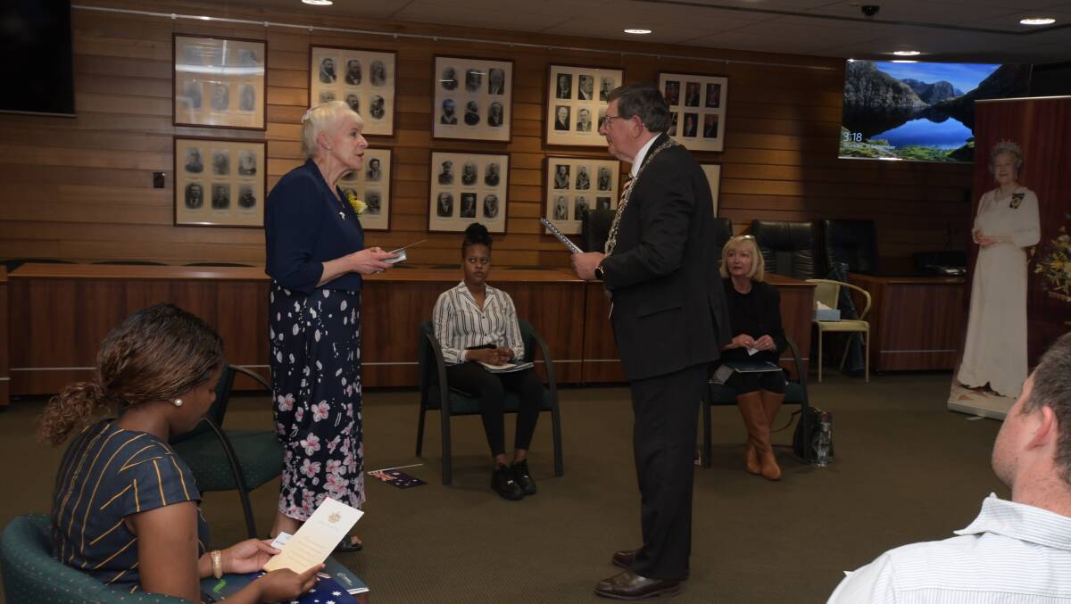 WELCOME: Mayor Kidd swears in Patricia Jordan Sola at the Australian citizenship ceremony. Photo: JUDE KEOGH.