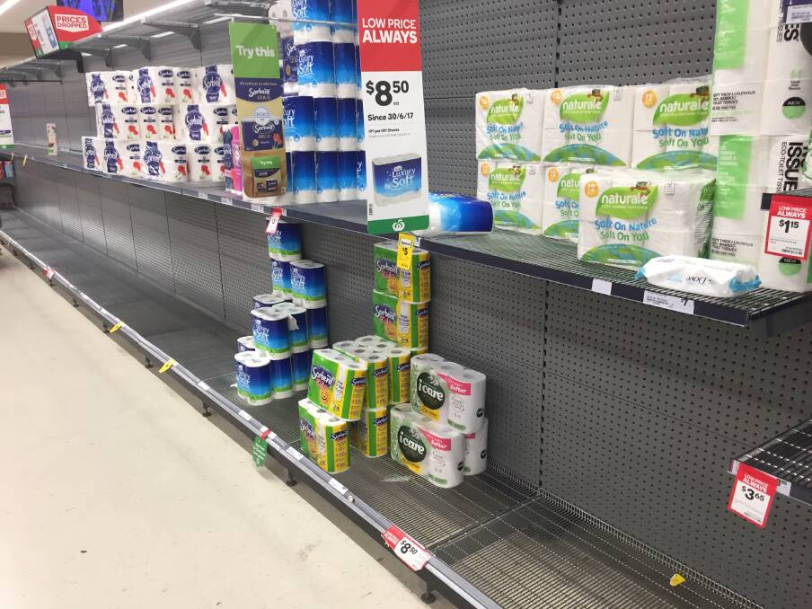 ROLL ON: There was plenty of space in the toilet paper area of one supermarket on Tuesday night. Photo: SUPPLIED.