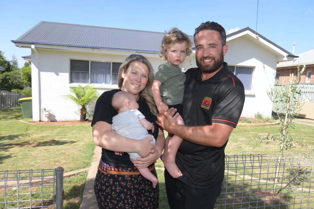 NEST EGG: Jade and Matty Georgiou with sons Remy, eight weeks, and Kaylen, two. The couple have two properties and work hard to increase their value. Photo: JUDE KEOGH.