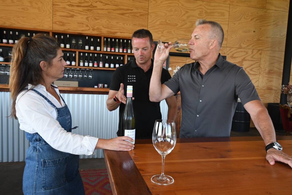 DROP BY: Tanya Segger and Nick Segger of Nashdale Wines with TV presenter David Reyne. Photo: JUDE KEOGH.