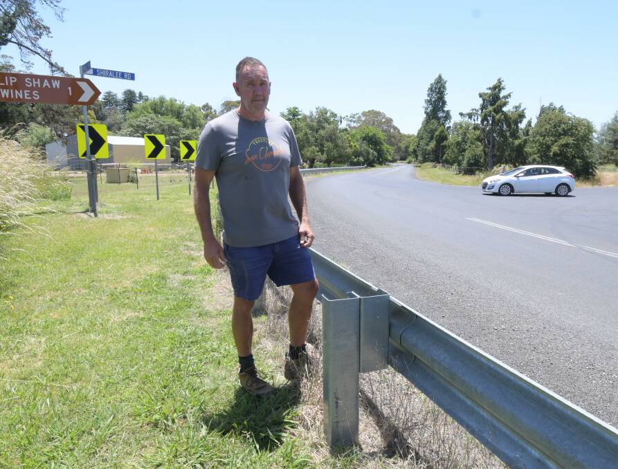 DANGEROUS: Geoff Naughton in front of a car turning right from Shiralee Road onto Pinnacle Road. Mr Naughton has seen many near-misses over the years. Photo: JUDE KEOGH.