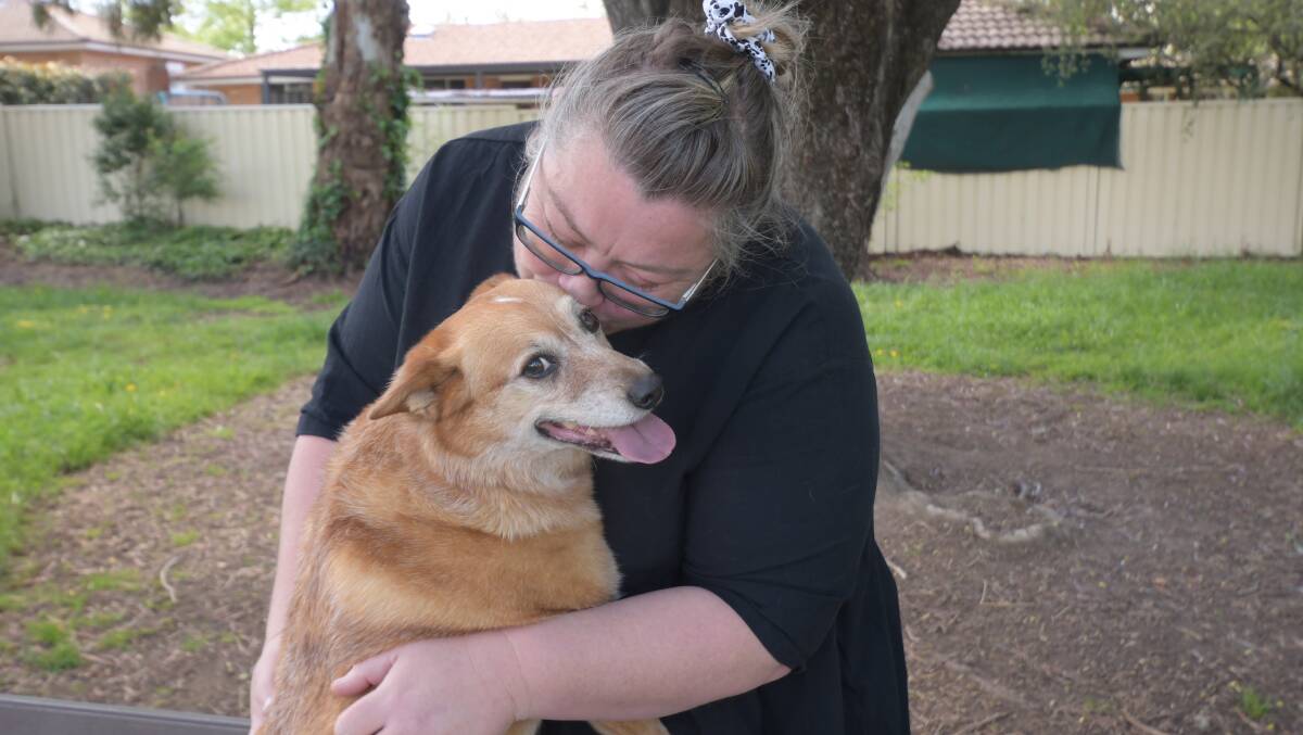 BEST FRIENDS Tina Pacey enjoys a special moment with Matilda at Machin Park. Photo: CARLA FREEDMAN.