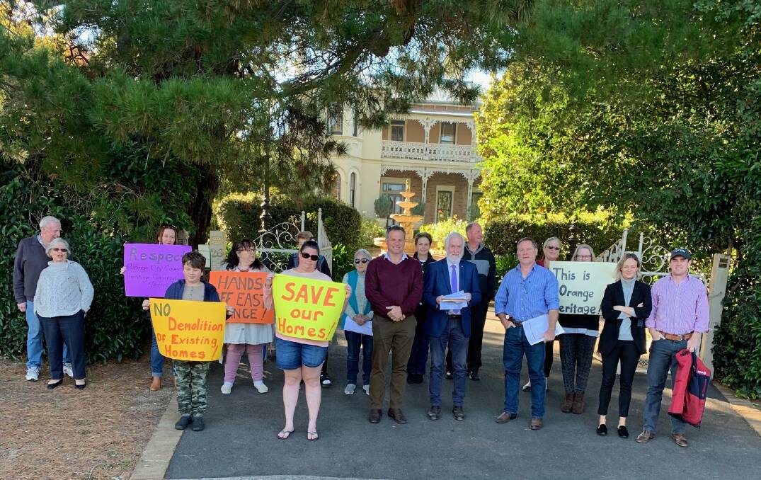 MEETING: State MP Phil Donato (centre, maroon jumper) on Spring Street with residents of East Orange protesting against redevelopment. Photo: SUPPLIED.