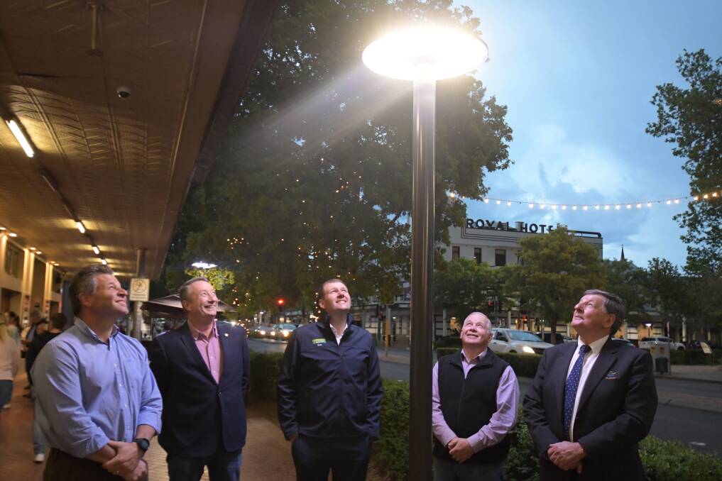 MESMERISED: Phil Donato, Ian Greenham, Sam Farraway, Jeff Whitton and Reg Kidd admire one of the new lights. Photo: CARLA FREEDMAN.
