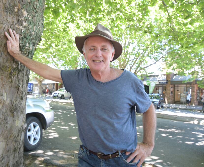 HANDS OFF: Sustainability expert Michael Mobbs was dismayed that anyone would even suggest felling the trees on Anson Street. Photo: JUDE KEOGH.