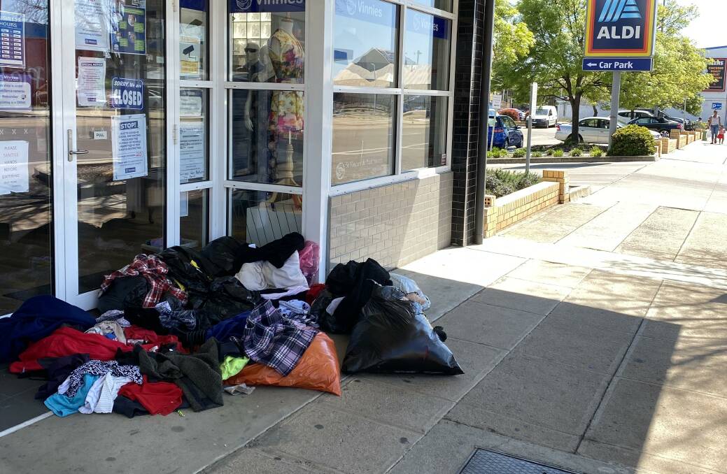 BIT SCRAPPY: Bags of clothing left outside the Vinnies shop on Peisley Street. Photo: SUPPLIED.
