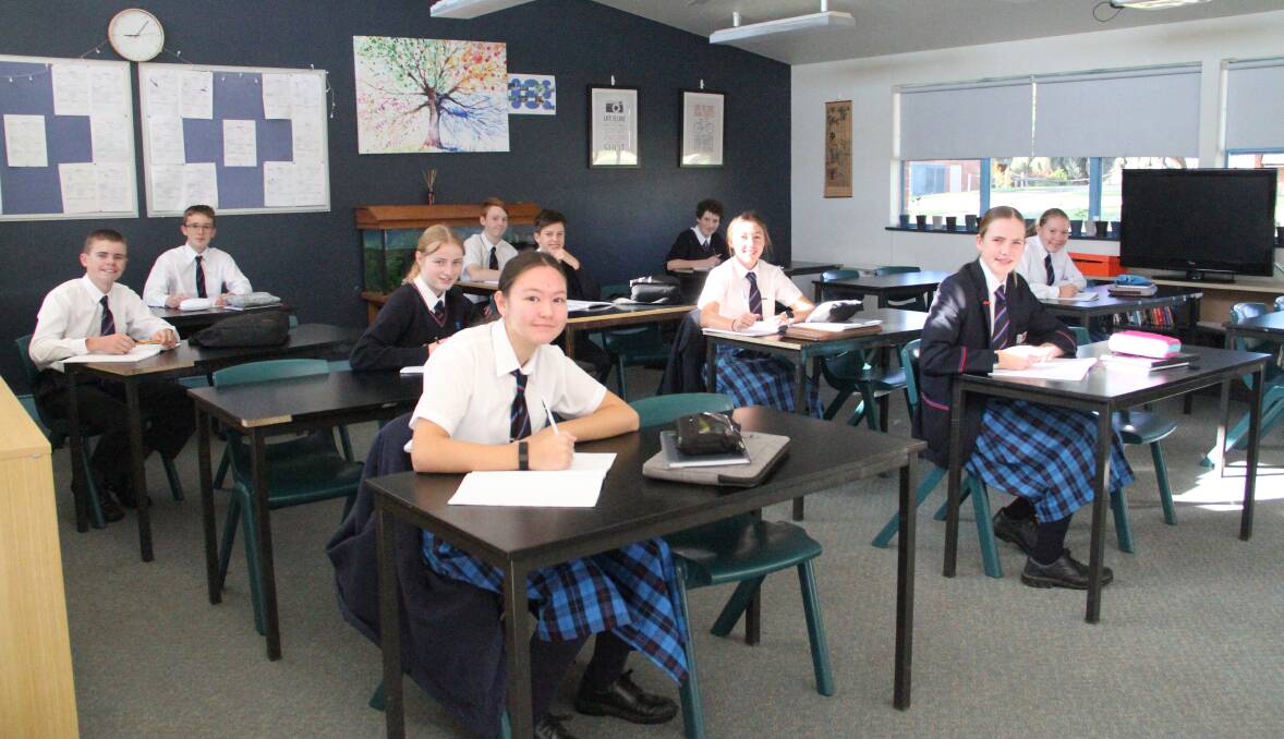 Middle school students (Year 8) getting on with learning in the classroom.