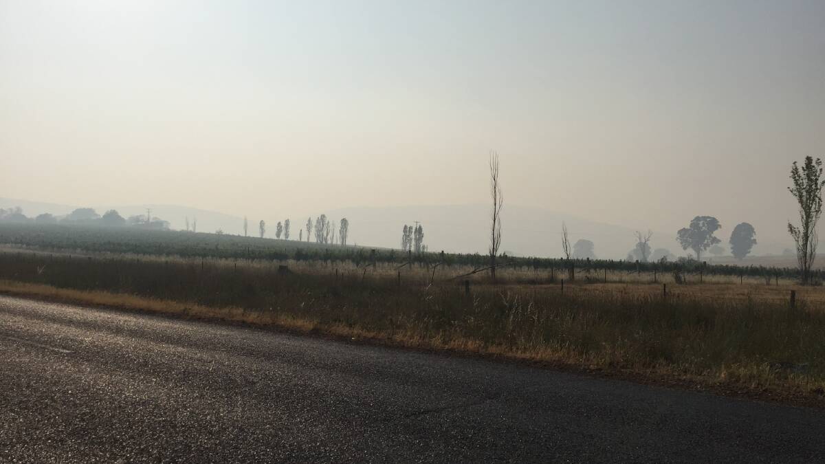 NO VIEW: The smoke is thick on Cargo Road. Photo: JUDE KEOGH.