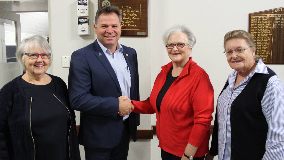 HELPING HAND: Member for Orange Phil Donato with the CWA's Helen Karrasch, Deborah Marr and Robyn Taylor as they celebrate funds to upgrade their hall. PHOTO: SUPPLIED.