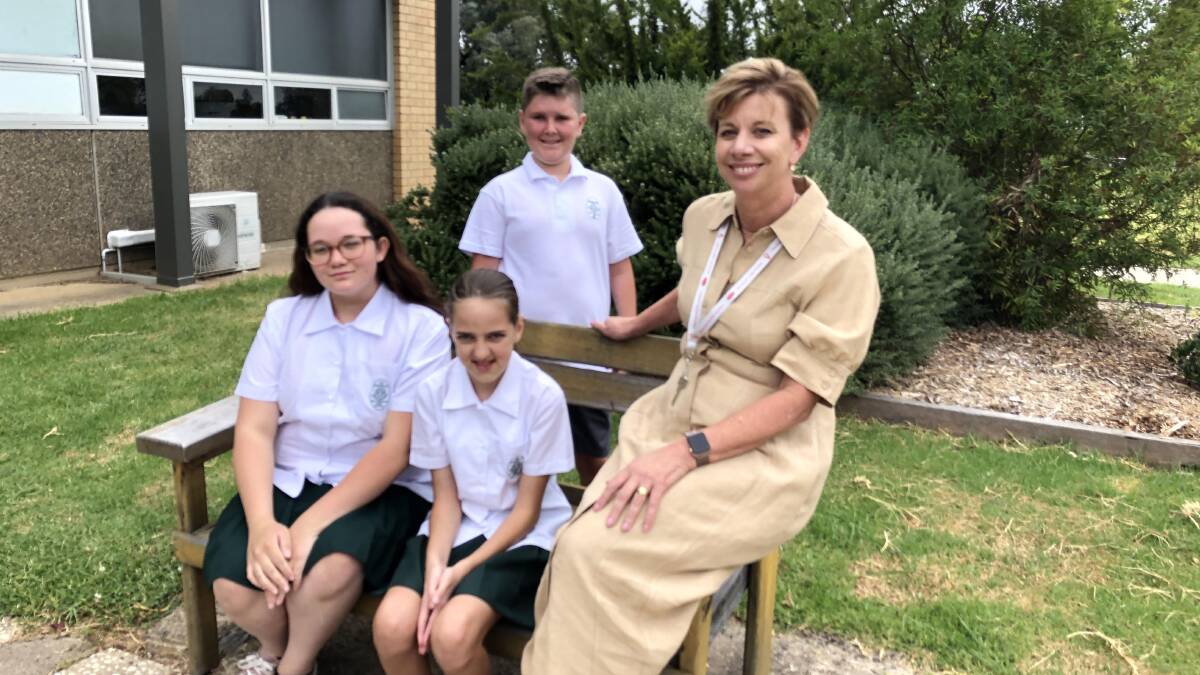FIRST DAY: Year 7 students Kellie May, Skylah Keen and Oliver King with Canobolas Rural Technology High School acting principal Michelle Barrett.
