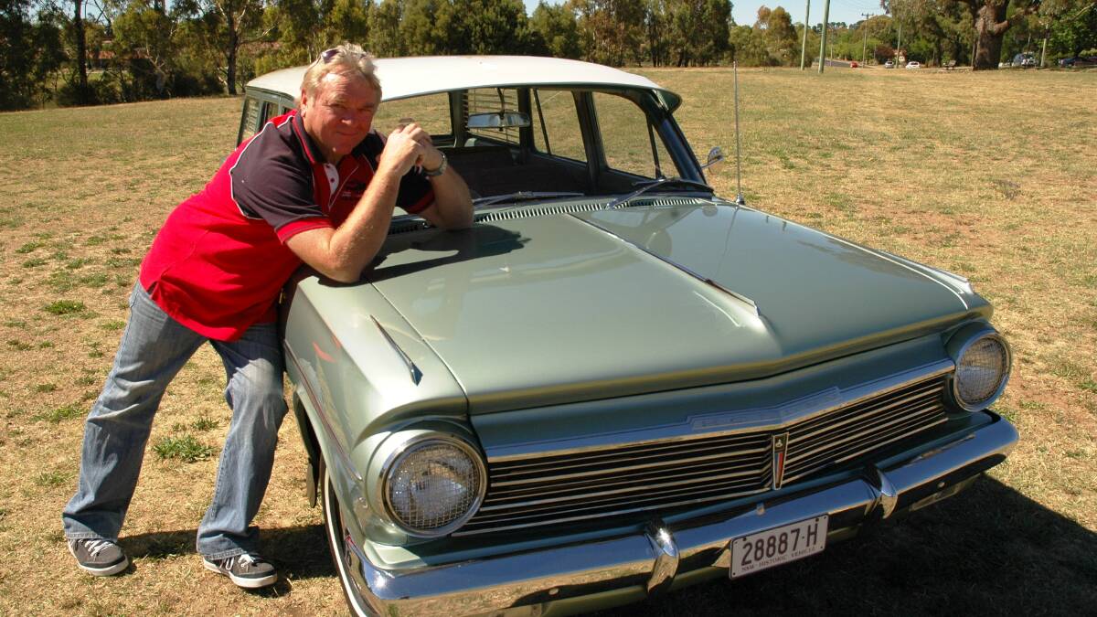 TIME TO SHINE: Col Pollack and his 1964 EH Premier Holden station wagon getting ready for Gnoo Blas Classic Car Show. Photo: SUPPLIED.