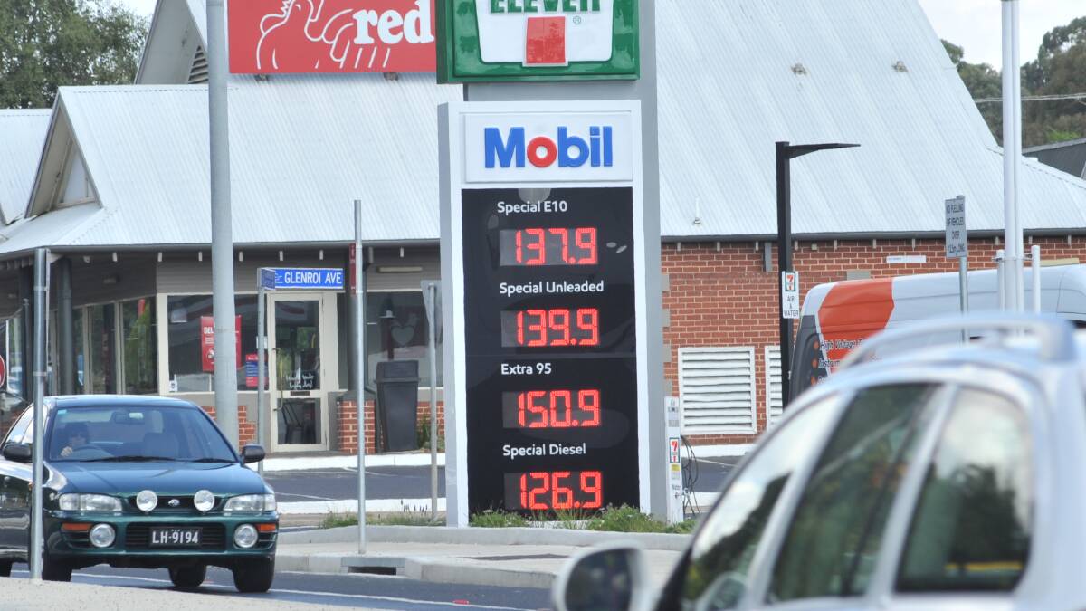 LOCK IT IN EDDIE: Convenience retailer 7-Eleven allows motorists to save the cheapest and nearest price to them, allowing them to take Sydney’s fuel prices home to Orange. Photo: JUDE KEOGH.