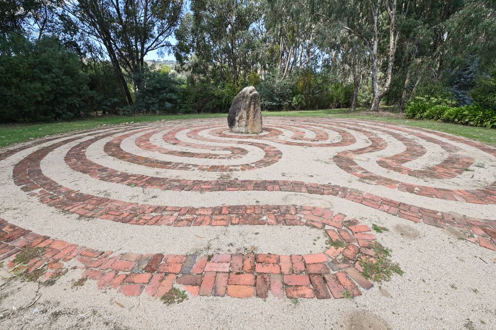 FAMILY FOCUSED: The grounds (above) include an ancient labyrinth, bocce, pentanque piste, giant chess, checkers and a creek walk.