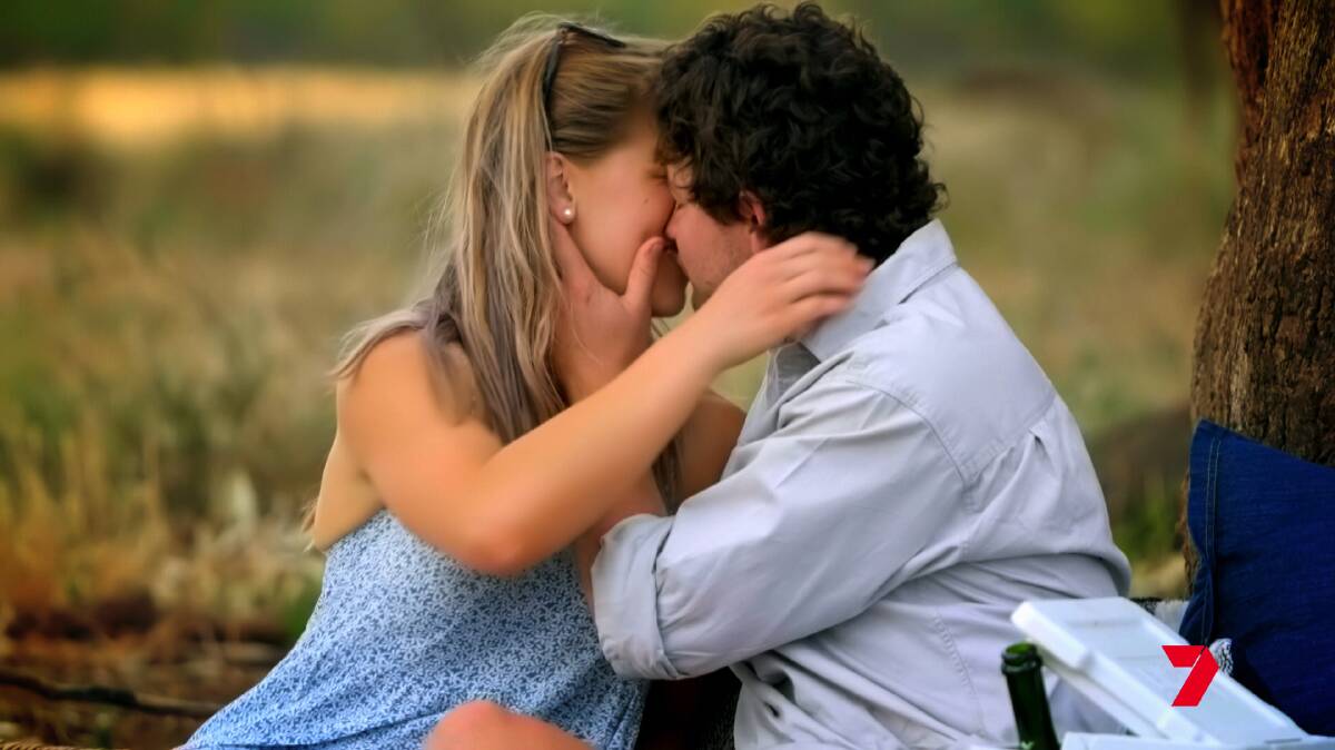 Farmer Dustin has a smooch with an as-yet-unnamed woman (the ladies will be announced in due course). Picture by Seven Network