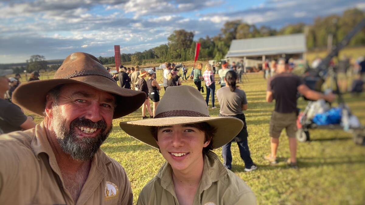 Mark Woodley, owner of Billy'o Bush Retreat in Wongarbon, with his 16-year-old son, Noah, as Farmer Wants a Wife shoots in the background. Picture supplied