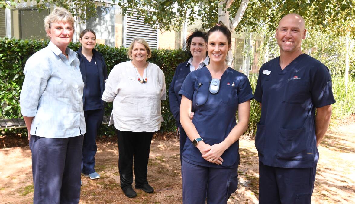 VACCINATIONS: Infection prevention and control CNCs Sue Lovell-Smart and Ashley Collett, director of nursing Jo Dean, emergency department nursing unit manager Mim Eaton and emergency nurses Khiarly Harris and Nathan Sturt are welcoming the start of vaccinations. Photo: JUDE KEOGH