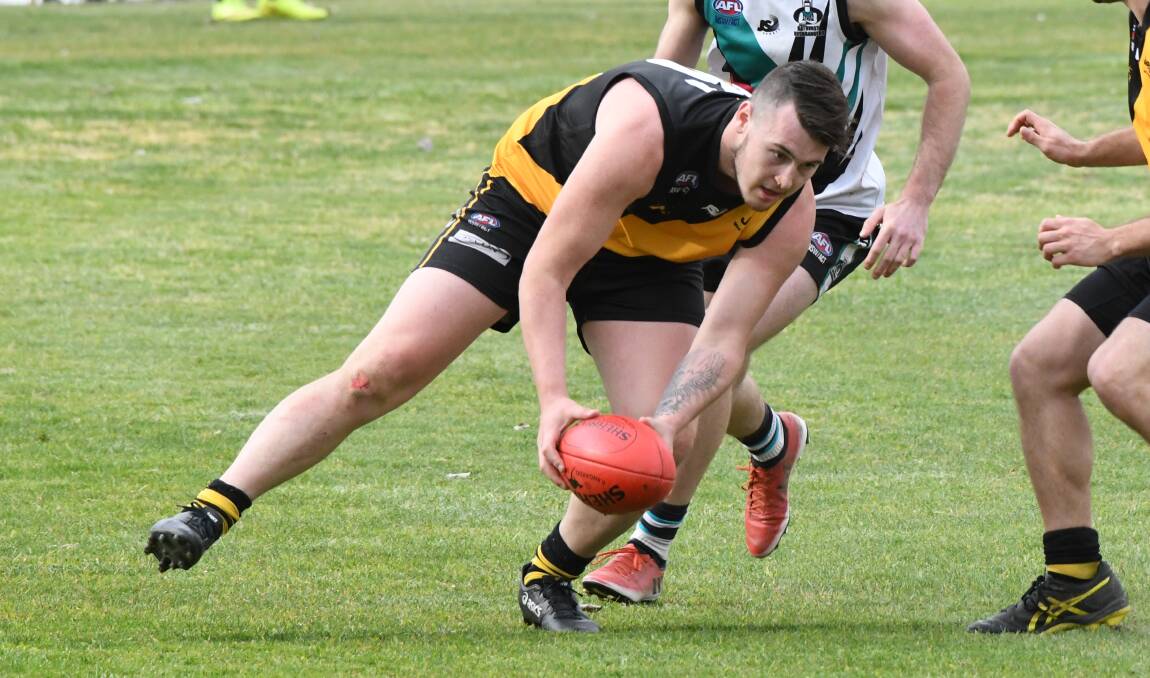 CHANGE AFOOT: Chris Rothnie and the Orange Tigers won this year's flag but it could be the last as a single-tier competition, CWAFL has proposed a shift to a two-tier structure. Photo: CHRIS SEABROOK
