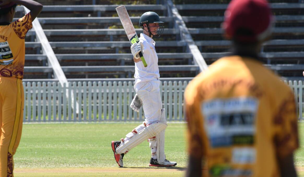MATCH-WINNER: Penith's Bailey Tebbutt raises his bat after passing 50 in Thursday afternoon's grand final win over North West Sydney. Photo: JUDE KEOGH