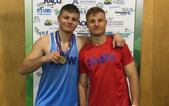 FATHER AND SON: Jack and Dave Littlefield, pictured moments after their national title win. Photo: CONTRIBUTED