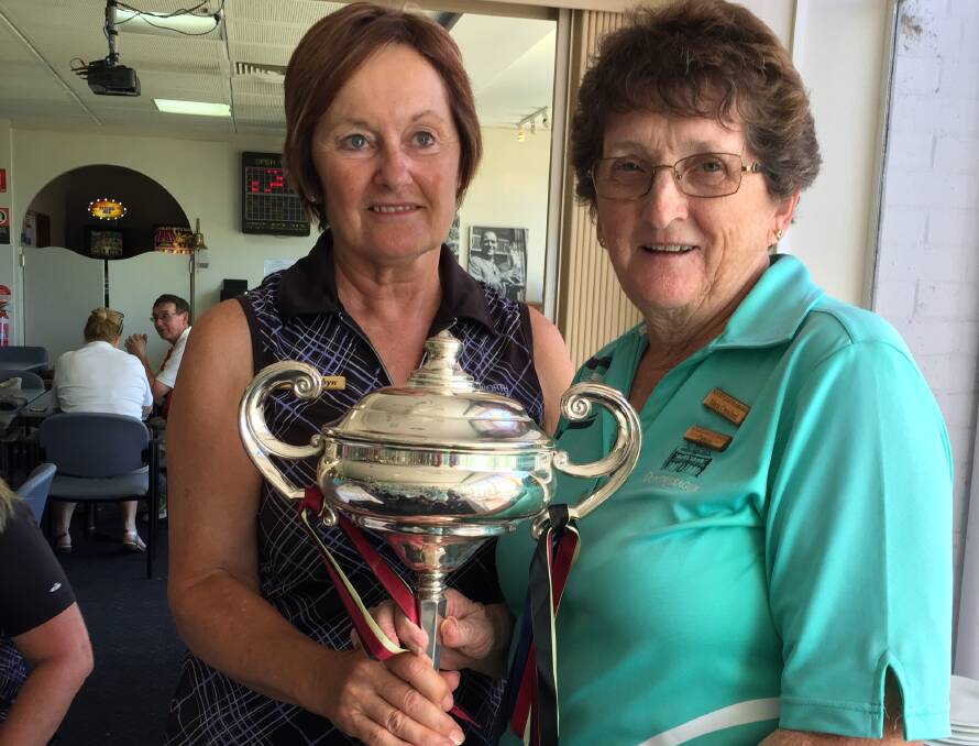 FRIENDLY RIVALRY: Duntryleague captain Maria Crawford accepting the Regency Cup Trophy from Wentworth captain Robyn Forrester.