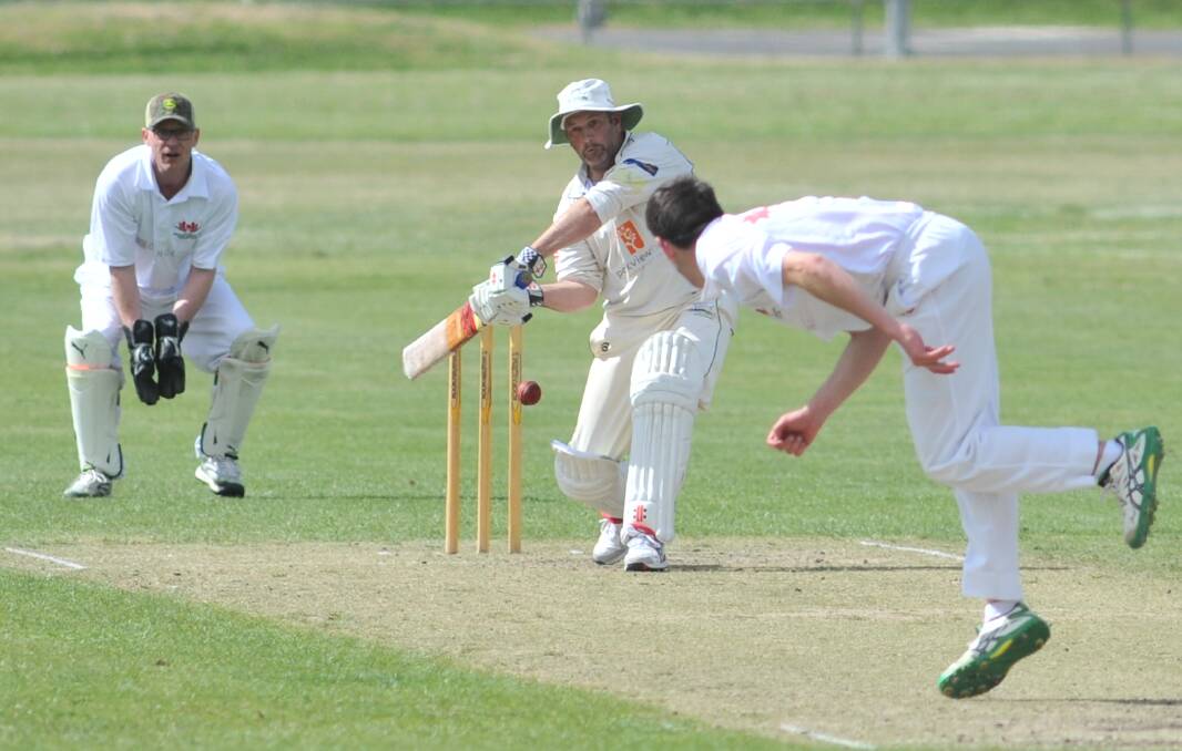 GOING BIG: Darren Barrett hits out in his dig of 53 not out against Waratahs on Saturday. His half-ton, and Joey Kay's, helped Orange City to its first victory of the second grade season. Photo: JUDE KEOGH 1014jk2ndscrick2
