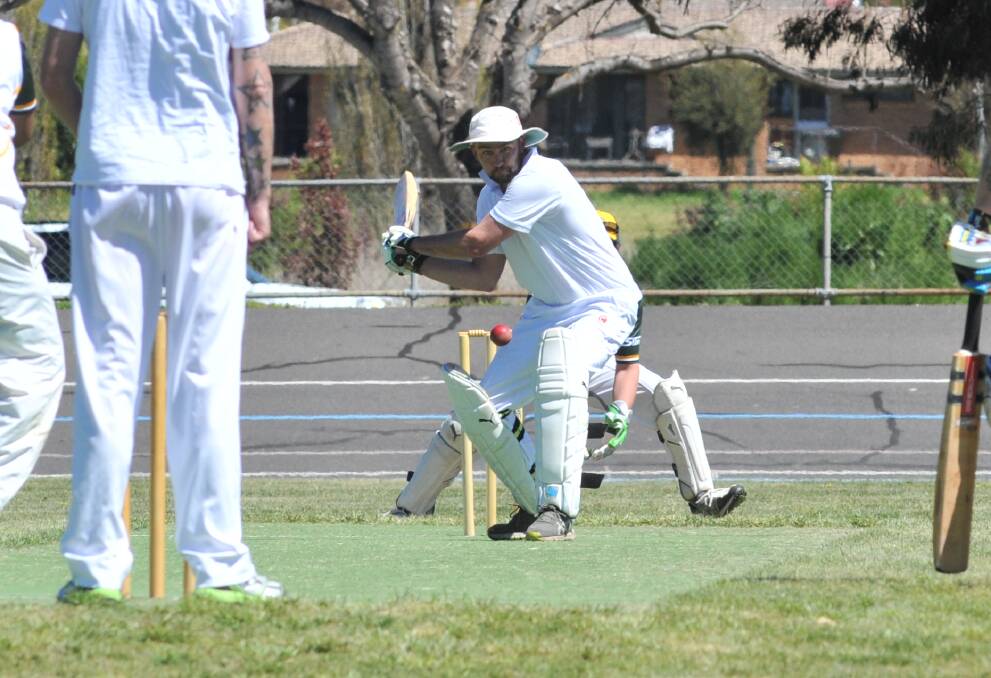 HITTING OUT: Wanderers batsman Kurt Gander hits out during his side's clash with CYMS at Moulder Park. Photo: JUDE KEOGH