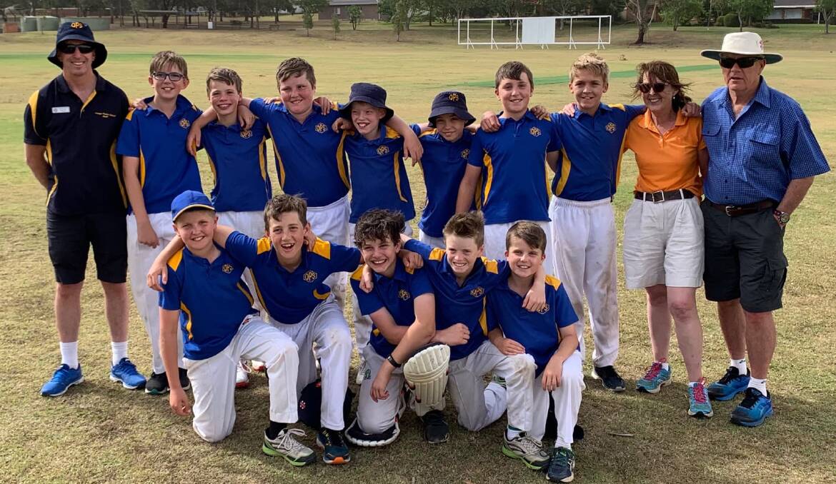 SILVER LININGS: Orange Public School's boys' cricket side, flanked by principal Brad Tom (left) and coaches Deb Smith and Mike Middleton (right), finished second in the state. Photo: STU MIDDLETON