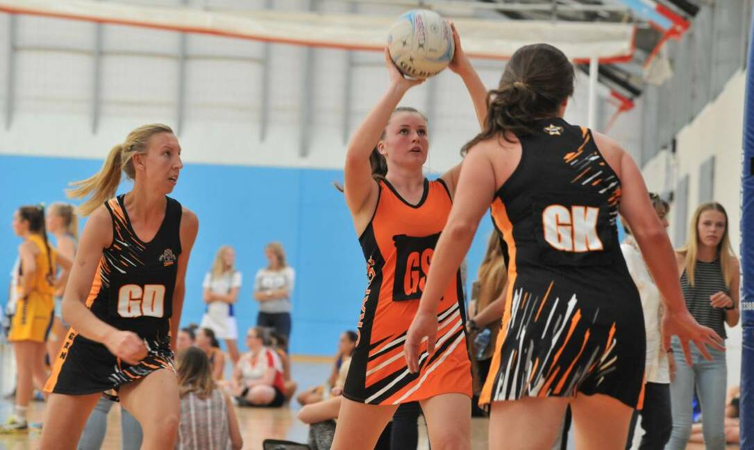 SHOOTING AROUND: Orange's Beth Curtin lines up a shot against Nyngan. Orange won all three of its games in Sunday's first round. Photo: JUDE KEOGH