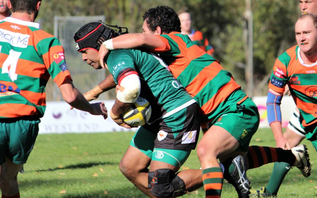OLD RIVALS: Orange City's Wayne Miller brings down Emus' Tom Fenualelei earlier this season, the two sides clash again in a huge reserve grade derby this weekend. Photo: DON MOOR