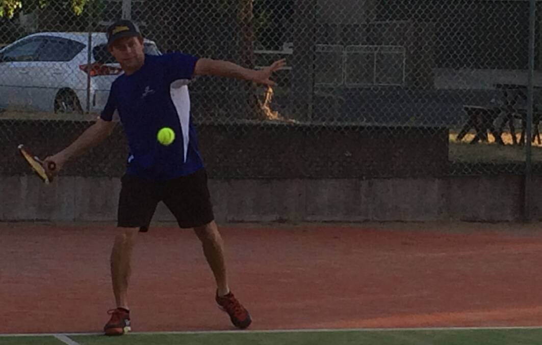 THAT'S A WINNER: Dave Foran slams down a forehand during the unisex social competition on Wednesday night. He and his partner played magnificently through the four rounds. Photo: CONTRIBUTED