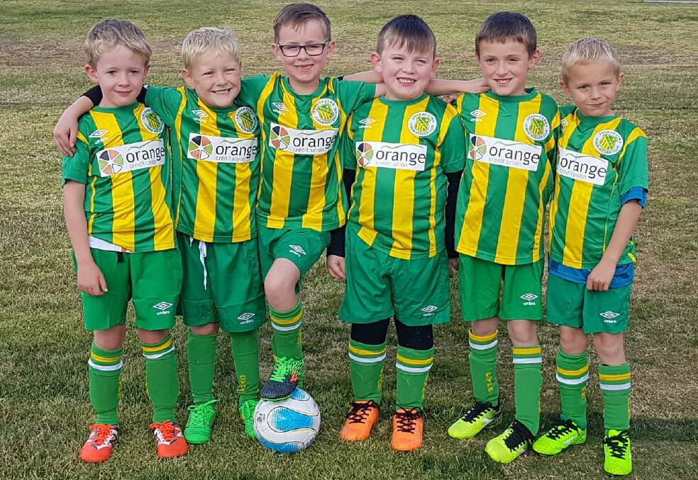 HAVING FUN: CYMS under-7 Green side had a ball against the Millthorpe Stripes on Saturday afternoon, (from left) Alby Kenney, Tom Ridding, Jack Flitcroft, Seth Bayada, Levi Grelli and Lewis Hinchcliff. Photo: PAUL FLITCROFT