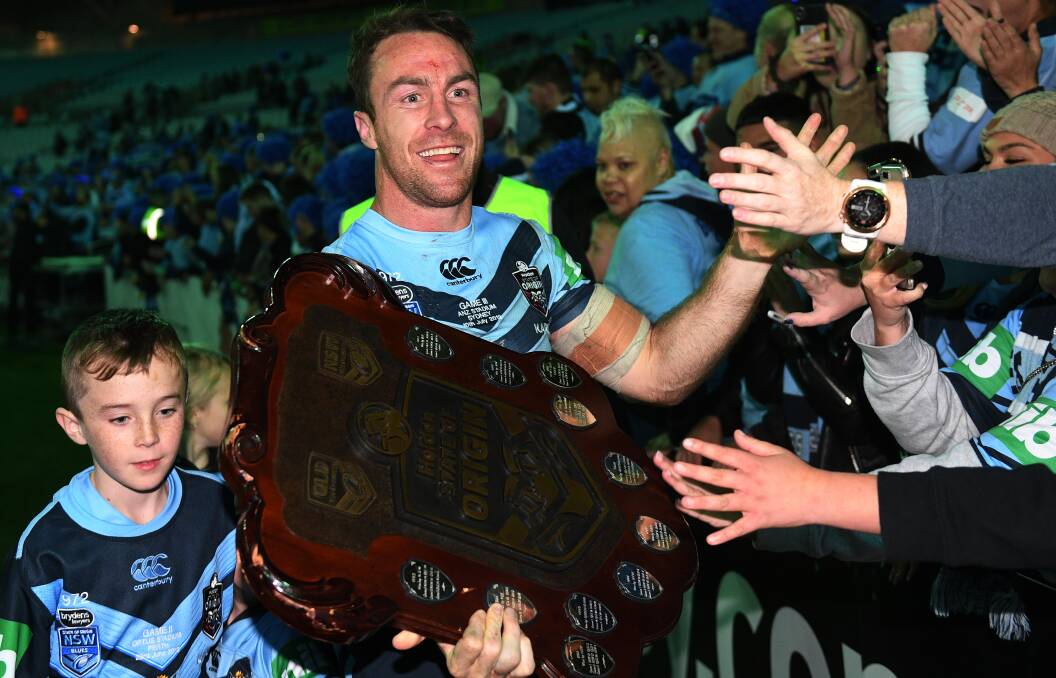 SWANSONG?: James Maloney celebrates NSW's series win with fans on Wednesday night, he's aware it might have been his last appearance for the Blues. Photo: AAP/DAN HIMBRECHTS
