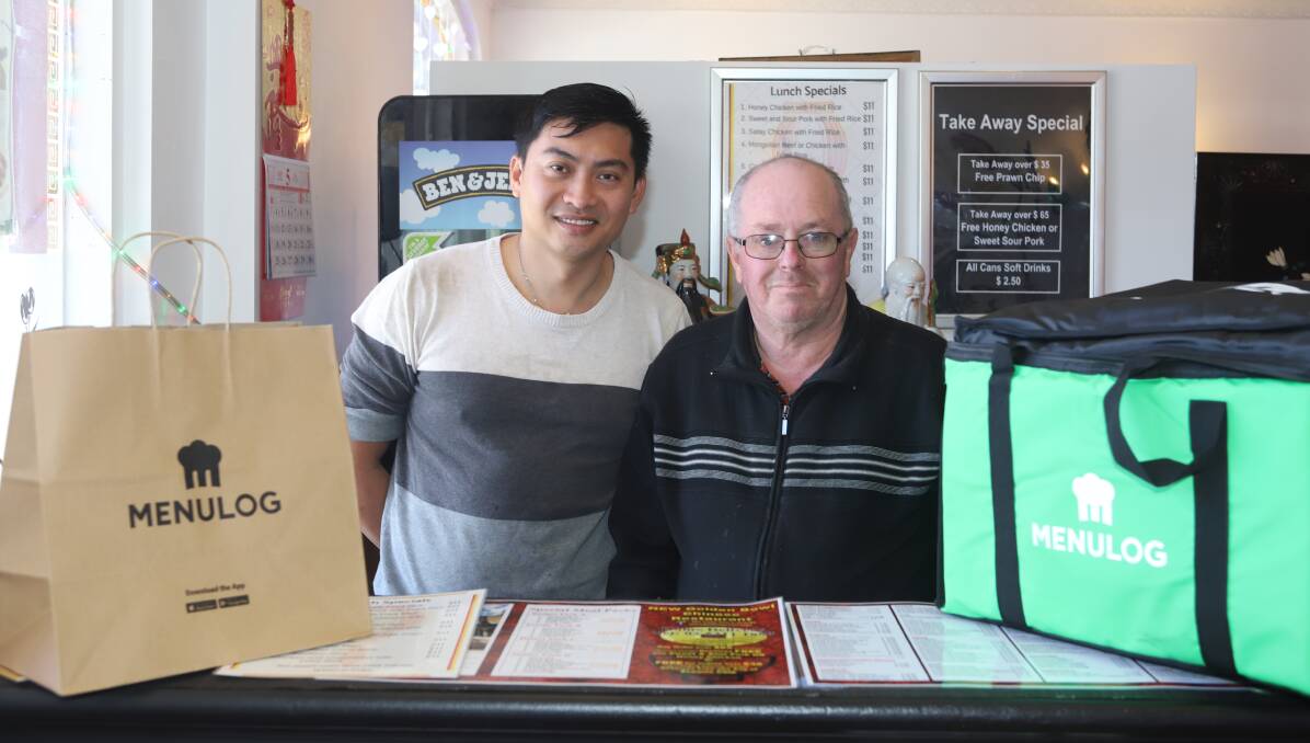 TAKEAWAY FOOD: New Golden Bowl Chinese Restaurant manager Jacky Teh and staff member Andrew Lennard. Photo: CARLA FREEDMAN