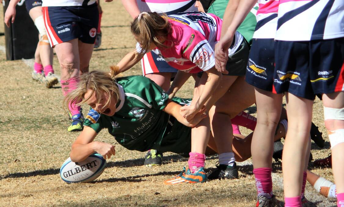 TRY TIME: Em McDonald crossed for a try against Cowra in this year's qualifying final, one of many she scored on her way to Emus' highest point-scorer award. Photo: DON MOOR