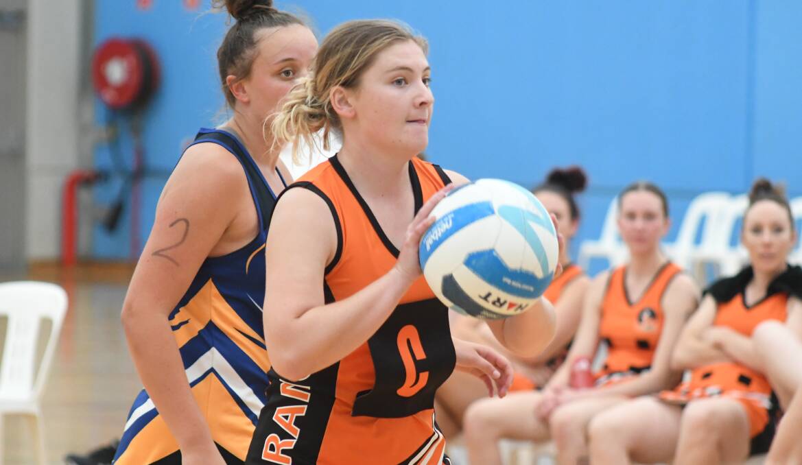 GRANTS OPEN: Brooke Burcher gets a pass away during a recent representative netball clash, the sport and Orange Netball Association could apply for grants. Photo: CARLA FREEDMAN