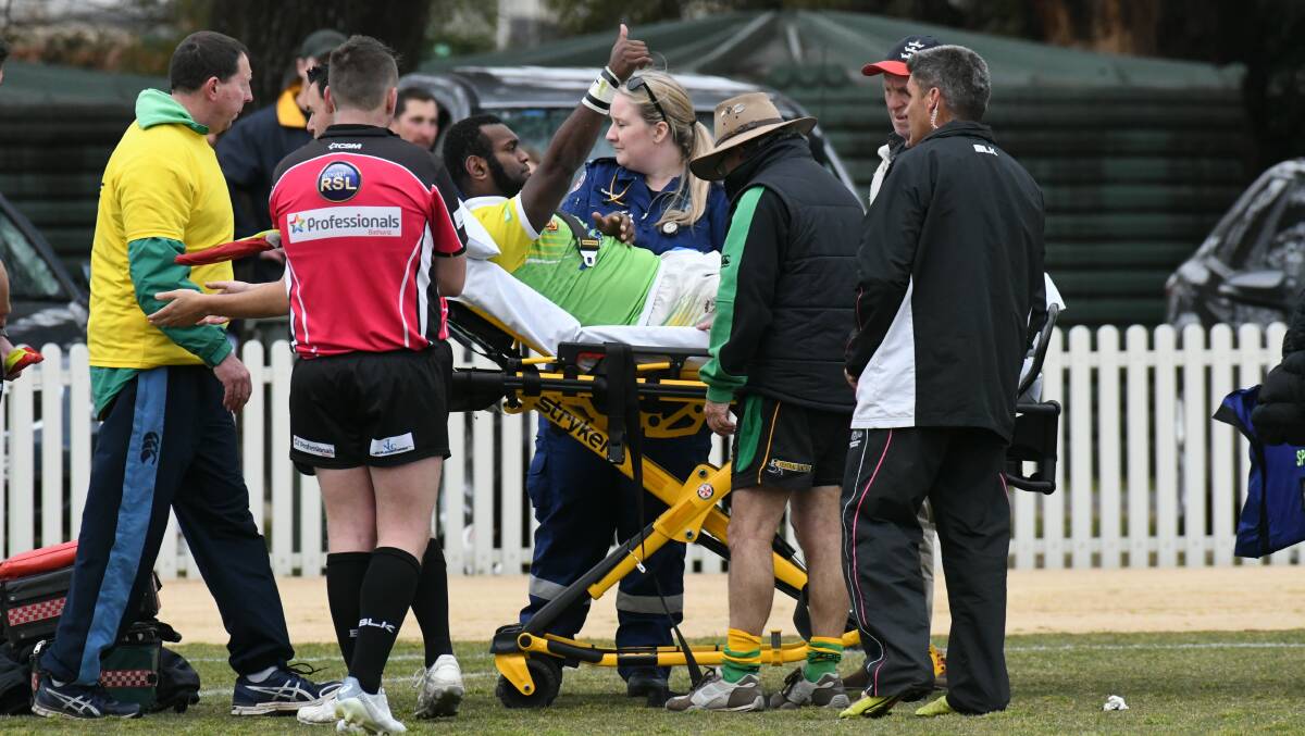 NASTY: Joe Lasagavibau gives the CYMS' faithful a thumbs as he's carted off with a shocking broken leg during the 2018 preliminary final. Photo: JUDE KEOGH