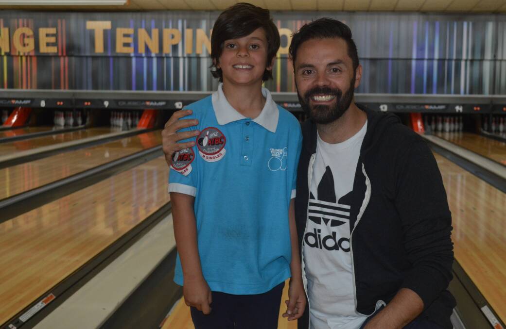 ON A ROLL: Hugo and Jason Belmonte at Sunday's NSW Country Junior Cup, it was the youngster's first tournament and he wore the same shirt his dad did in the 1992 edition. Photo: MATT FINDLAY