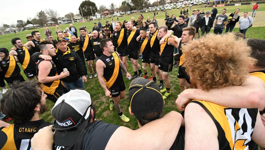 TIGERLAND: Mick Rothnie leads the Tigers' victory song after their outrageous comeback win in the 2018 AFL Central West grand final. Photo: PHIL BLATCH