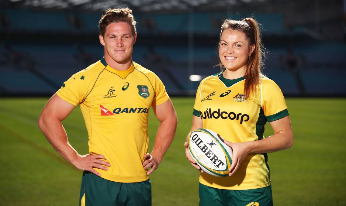 ON HOME SOIL: Grace Hamilton, with Wallabies' gun Michael Hooper, and her Wallaroos will play their first home Test match in 10 years in August. Photo: MATT KING