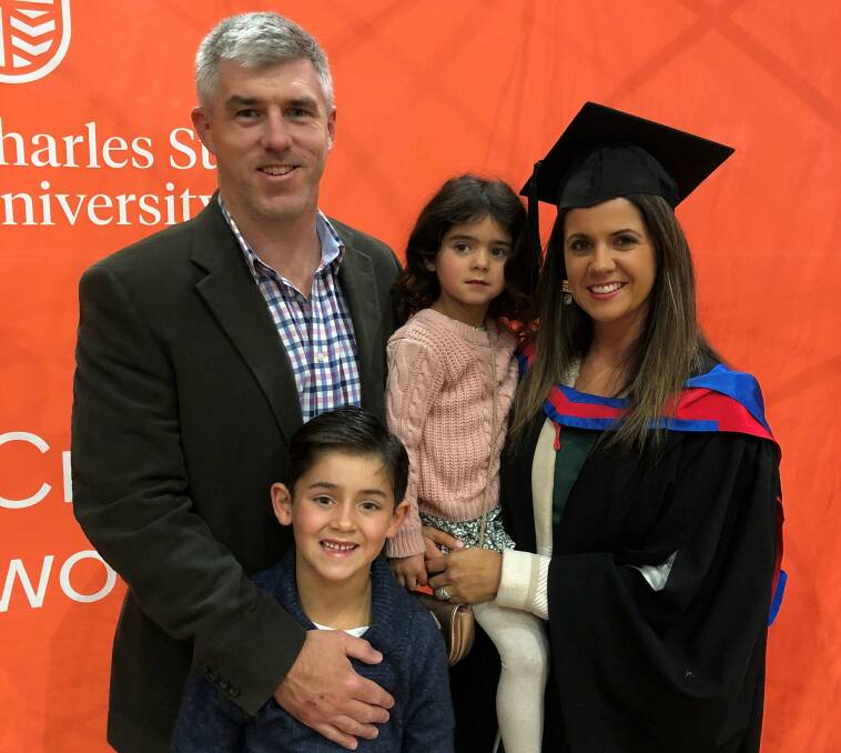 PROUD FAMILY: Al, Angus, Tilly and Jenna Hattersley celebrate the latter's graduation from Charles Sturt, after eight years of part-time study. Photo: CHARLES STURT MEDIA