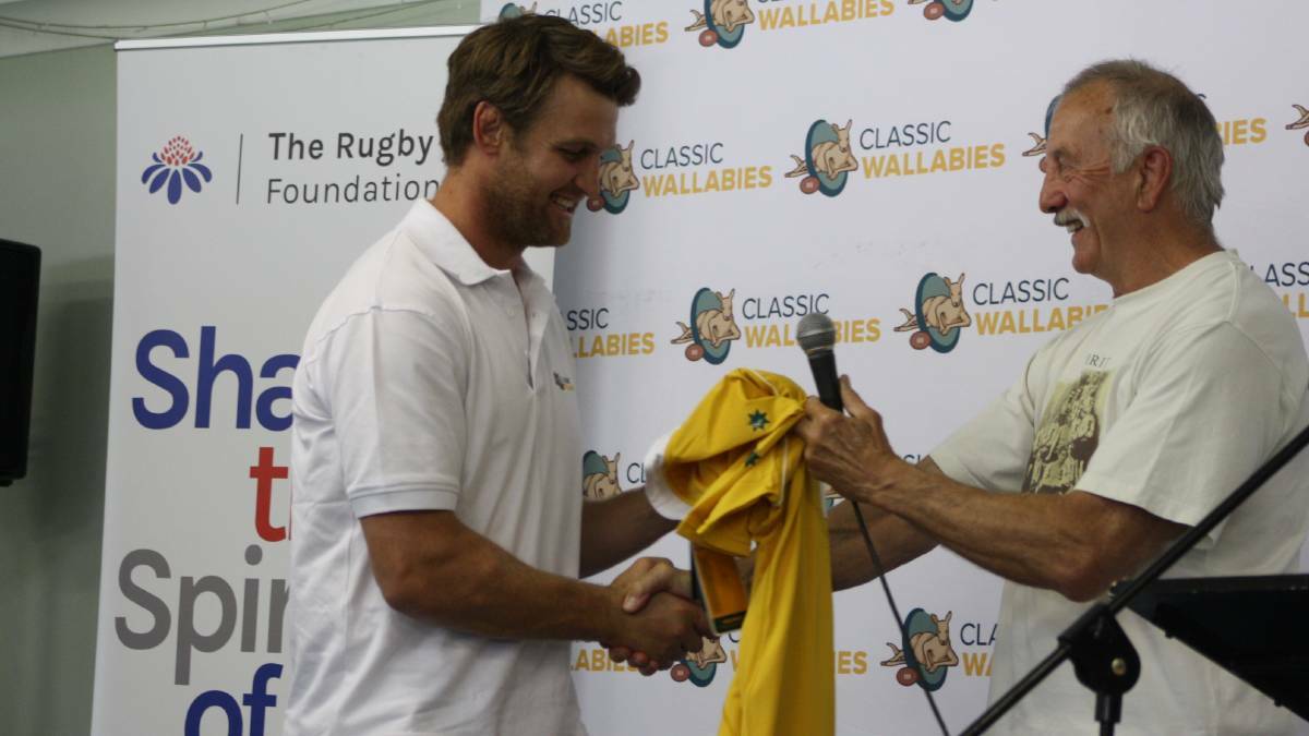 CLASSICS: McCutcheon is presented his Classic Wallabies jersey at Orange last year, where his side took on the Blue Bulls Legends. Photo: MICHELLE COOK