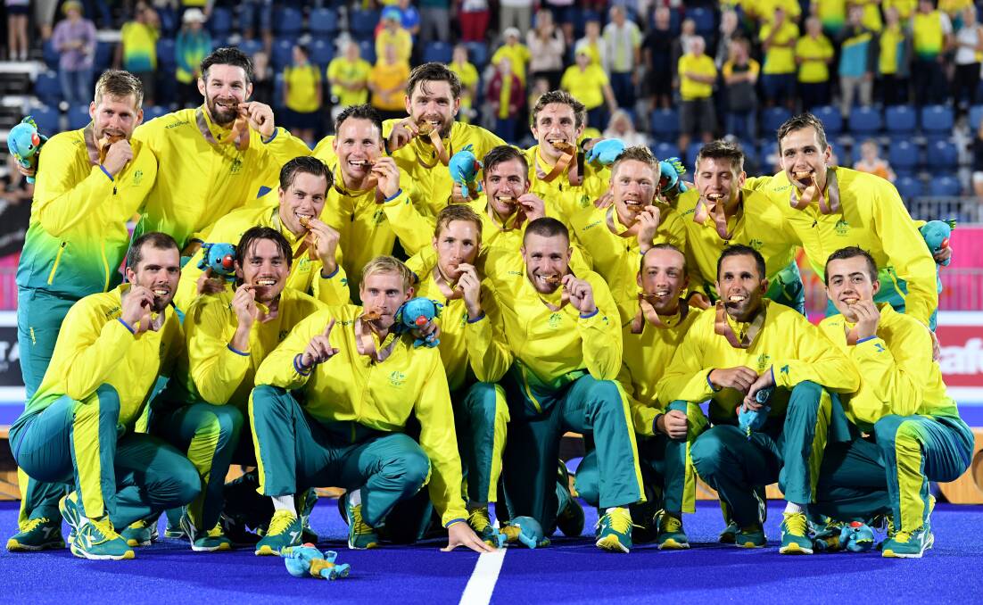 GO FOR GOLD: Lachlan Sharp's Kookaburras celebrate their gold medal win. Photo: AAP/DEAN LEWINS