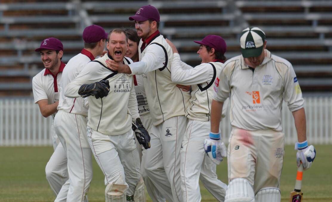 JUBILATION: Cavaliers celebrate taking the scalp of Shaun Grenfell, a dismissal that at the time looked almost match-deciding. Photo: MATT FINDLAY