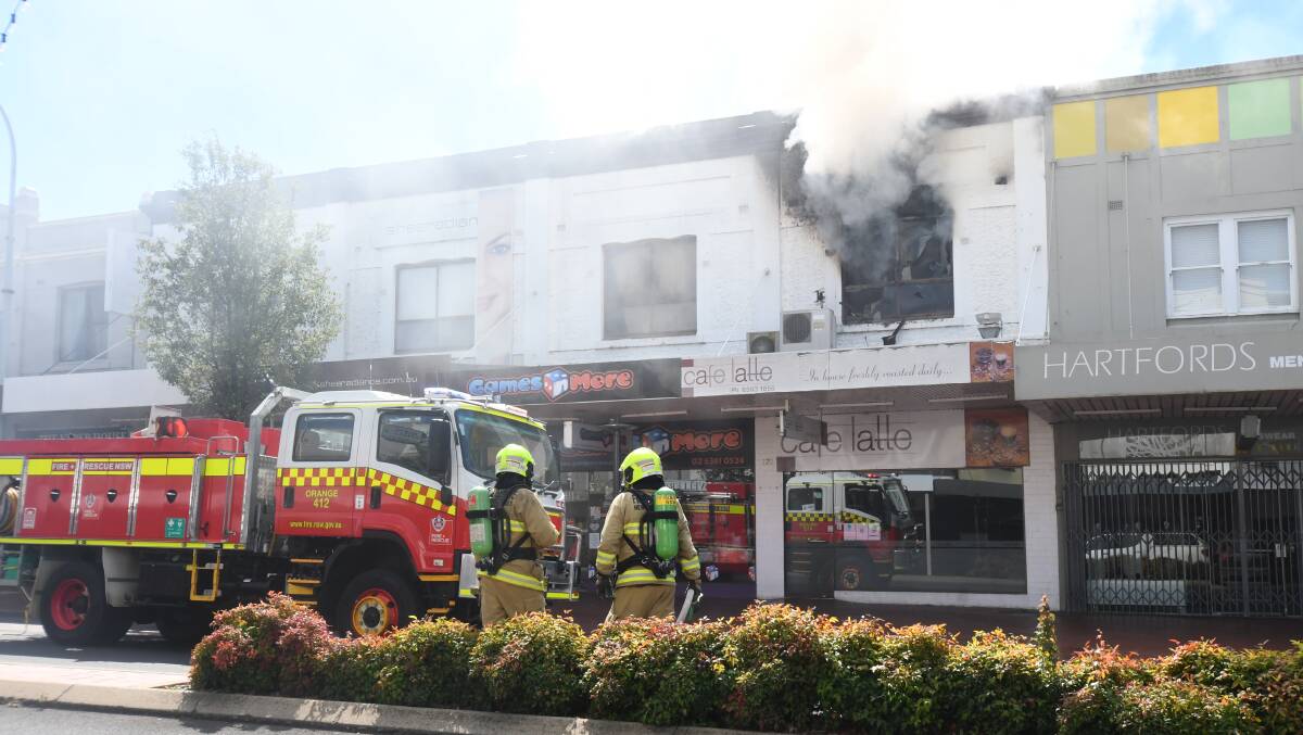 INFERNO: Fire crews from Bathurst and Kelso were called in to help fight a blaze on Orange's main street on Monday afternoon. Photo: CARLA FREEDMAN