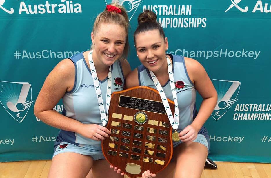 GOLDEN GIRLS: Orange's Chloe Barrett and Dubbo's Emma Corcoran celebrate their national title win with NSW. Photo: CONTRIBUTED