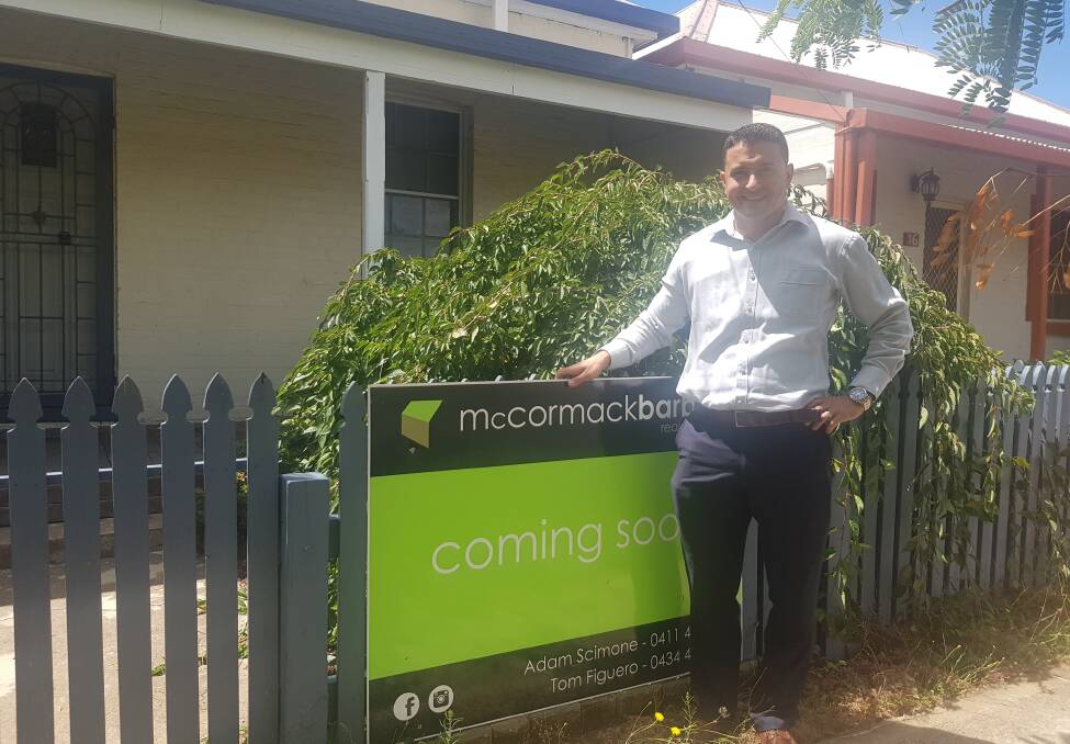MARKET BOOM: McCormack Barber's Adam Scimone outside an Autumn Street listing. Real estate agents in Orange are suggesting the state of the market is bordering on unprecedented. Photo: MATT FINDLAY