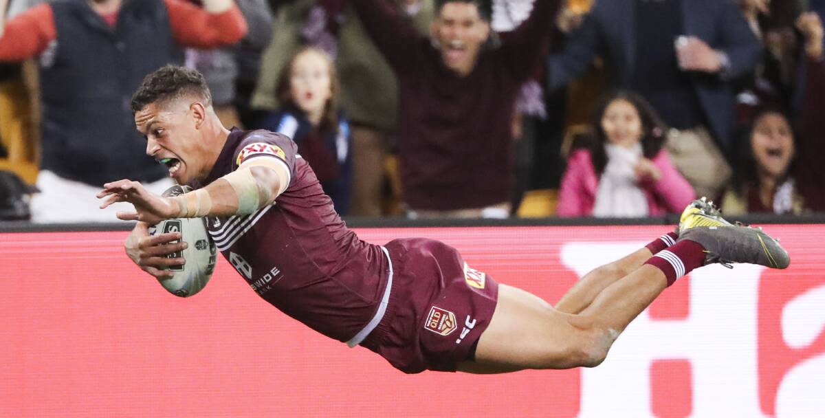 FULL FLIGHT: Dane Gagai soars to score his first try on Wednesday night, after sprinting 95 metres from an intercept on his side's line. Photo: AAP/GLENN HUNT